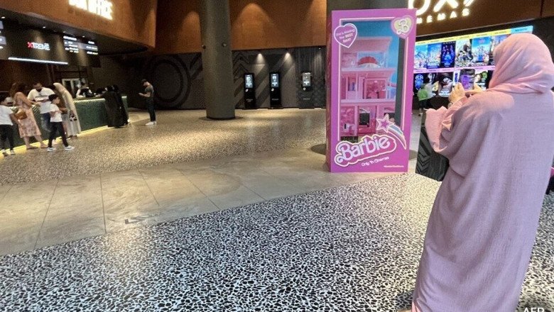Rewrite the given title into SEO friendly and easily readable and attractive.Women In Pink Watch ‘Barbie’ In Dubai, Saudi Arabia Amid Ban In Many Gulf Nations