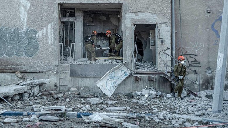 Iranian strike in Israel injures nearly 2 dozen, emergency officials say, amid diplomatic efforts