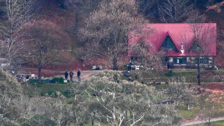Police hunt Australian man believed to be radicalized, well-armed conspiracy theorist who killed 2 officers