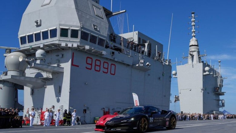 Man in a Ferrari on an aircraft carrier attempts to set record for fastest car driven on a boat